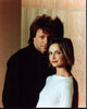 Jon Bon Jovi and Calista Flockhart leaning on a wall photo print.