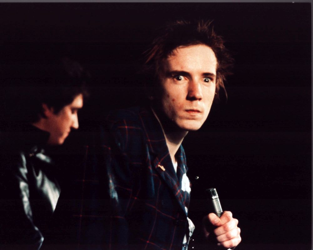 John Lydon on stage in plaid jacket photo print