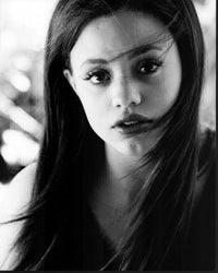 Black and white photo print of Sarah Jeffery in windblown headshot style.