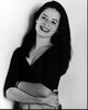 Black and white photo print of Holly Marie Combs with arms crossed leaning on a wall.
