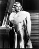 Penelope Ann Miller black and white photo print on staircase in gown with fur.