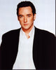 John Cusack photo print in white shirt and black blazer, capturing Hollywood style.