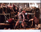 Peter Mensah Fighting in Spartacus Photo Print showcasing an intense battle scene.