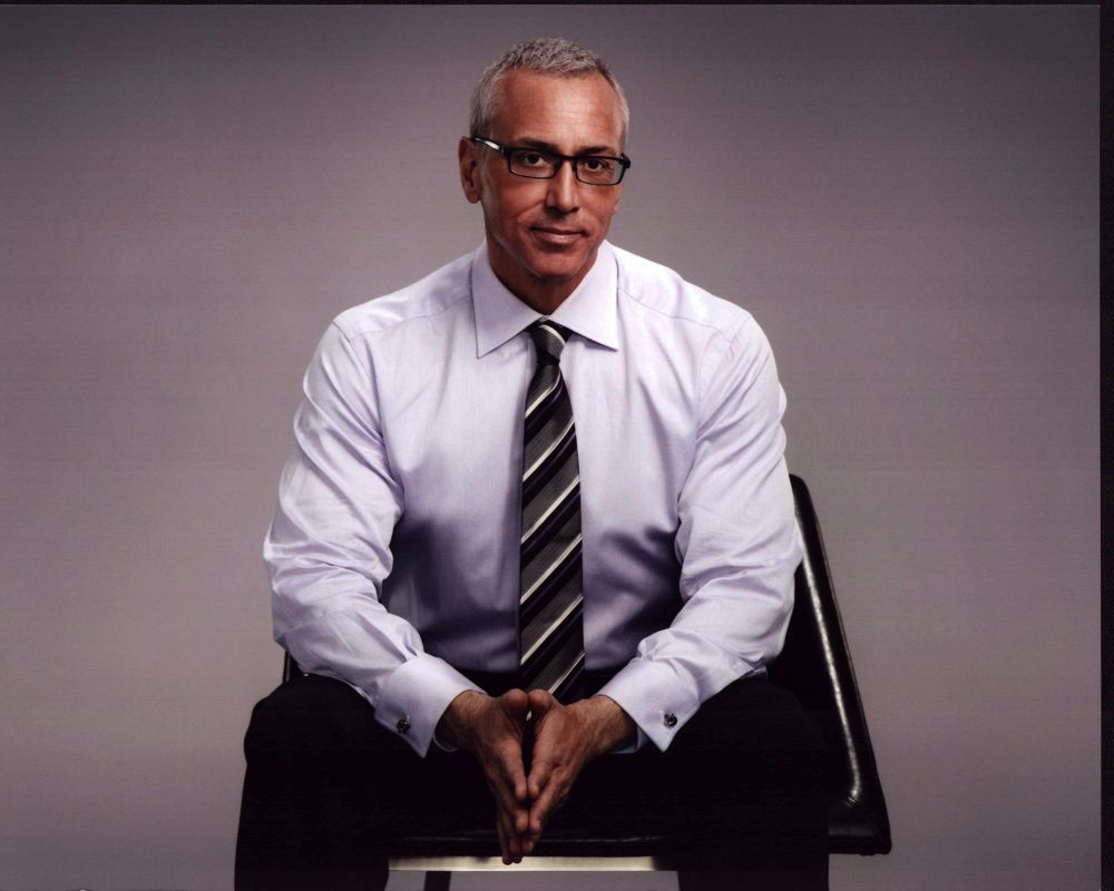 Drew Pinsky sitting in a chair photo print