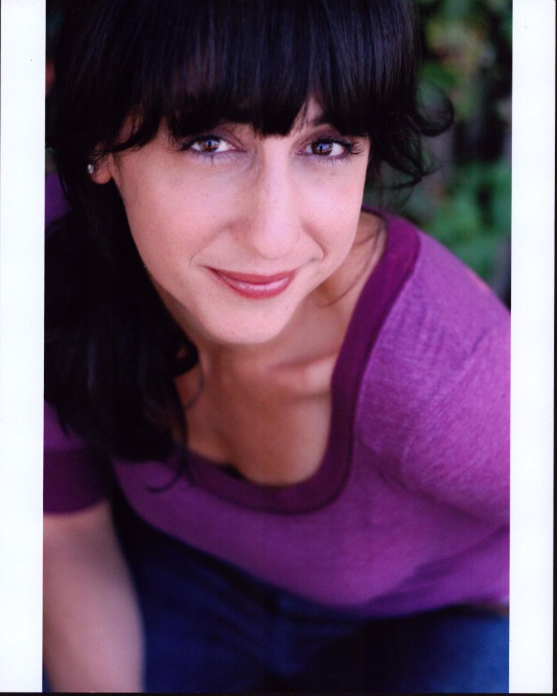 Leslie Meisel headshot photo print in purple top.