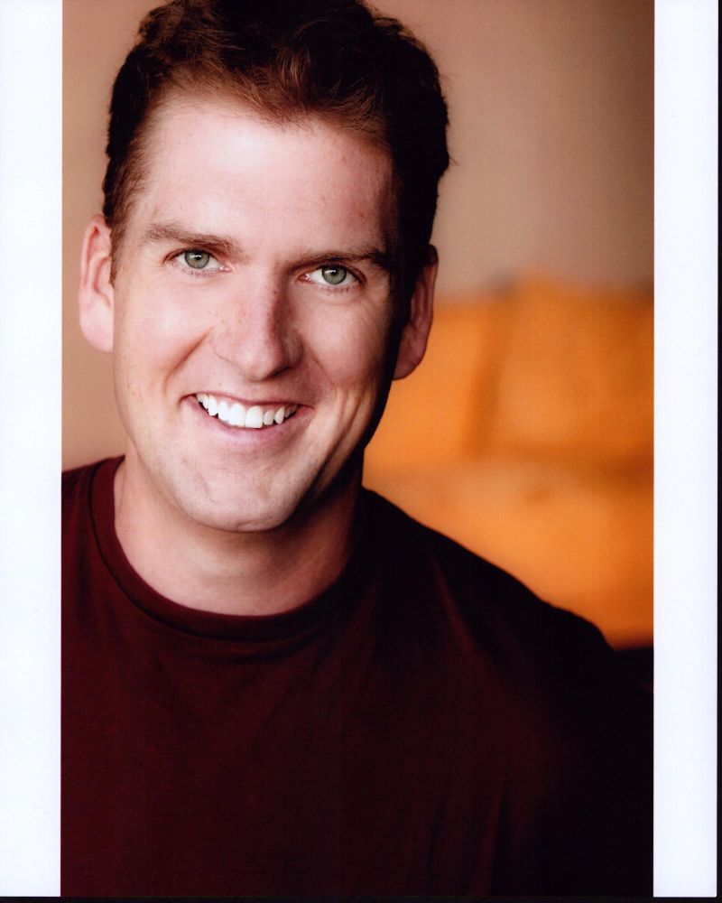 Regan Burns headshot photo print in red sweater, 8x10