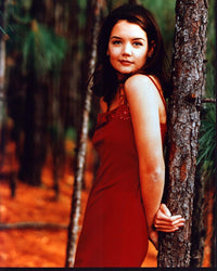 Katie Holmes in a red dress leaning on a tree - photo print