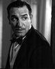 Jean Dujardin black and white photo print looking over shoulder.