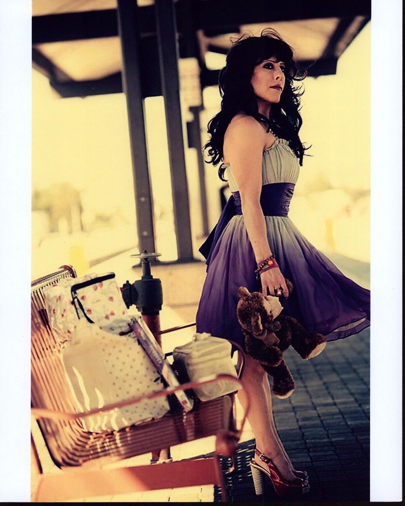 Misty Rosas on train platform with teddy bear photo print