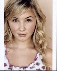 Audrey Whitby headshot photo print featuring her in a white and pink top.