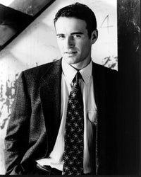 Julian McMahon black and white photo print in a suit with hands in pockets.