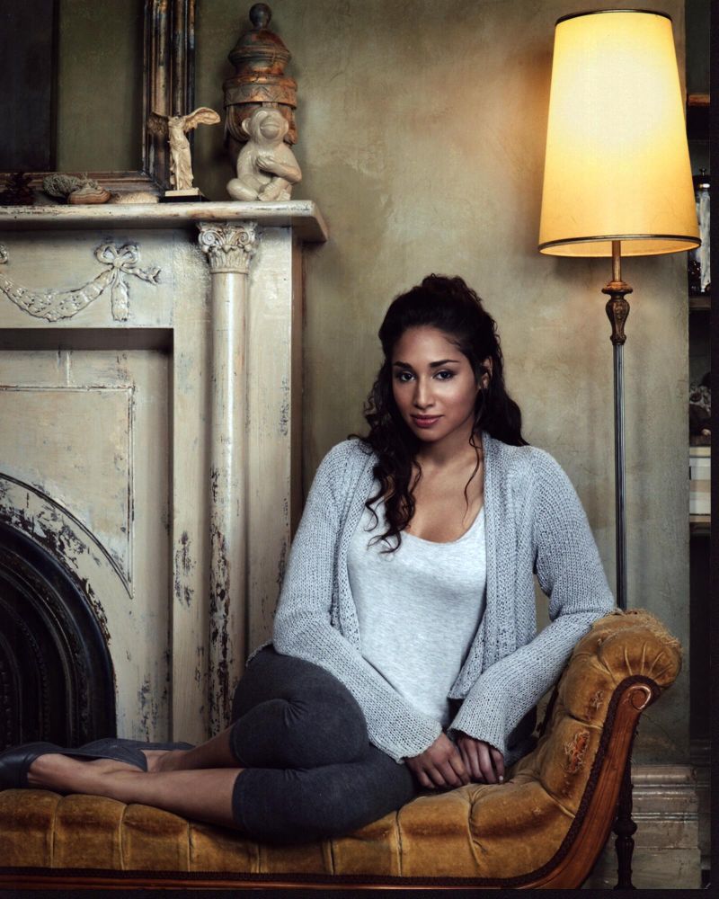Meaghan Rath cozy sweater photo print showcasing her charm and style.