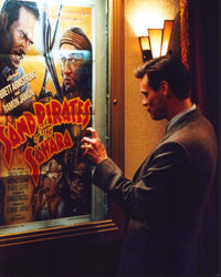 Jim Carrey Looking At The Majestic Movie Poster - Photo Print