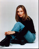 Calista Flockhart Tying Boots Photo Print capturing elegance and style.