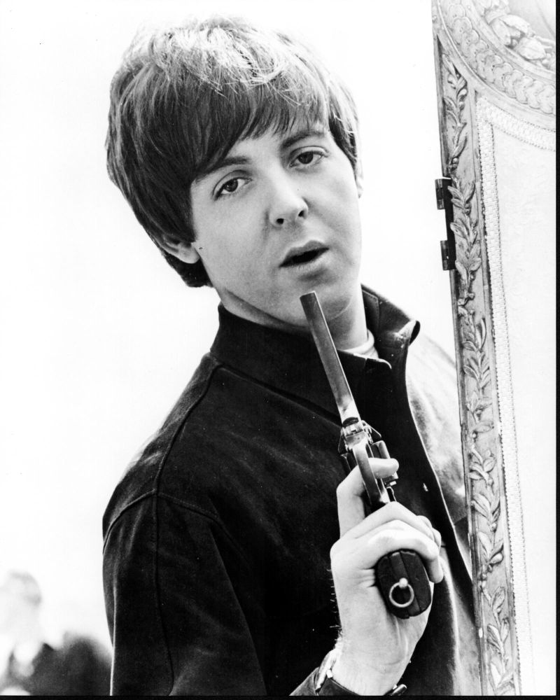Paul McCartney blowing on gun black and white photo print.