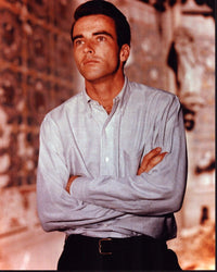Montgomery Clift photo print in striped shirt with arms crossed.