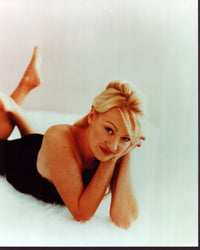 Portia De Rossi laying on a white rug photo print