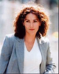 Kim Delaney photo print in gray suit and white top.