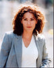 Kim Delaney photo print in gray suit and white top.