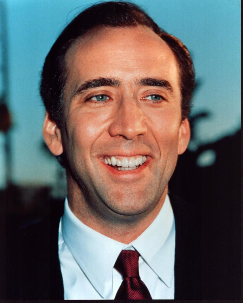 Nicholas Cage in Black Suit and Red Tie Photo Print