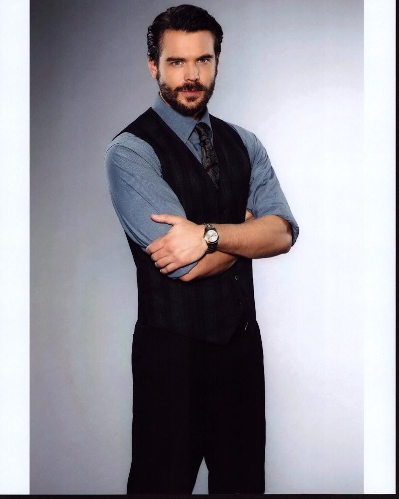 Charlie Weber photo print in black vest with arms crossed