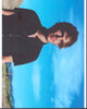 Ellar Coltrane in black top photo print against desert background