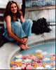 Julia Roberts photo print sitting by the pool with floating flowers.