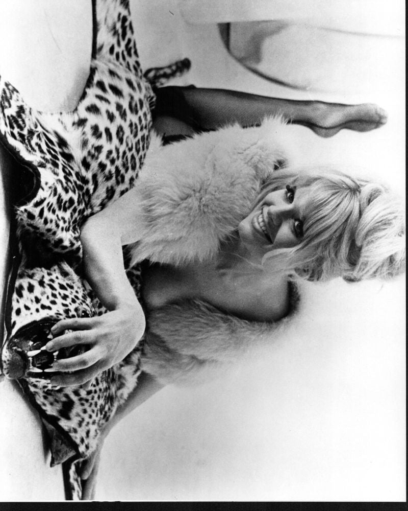 Carol White Laying on Leopard Rug Black and White Photo Print