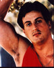 Sylvester Stallone photo print in red tank top, arm up pose.