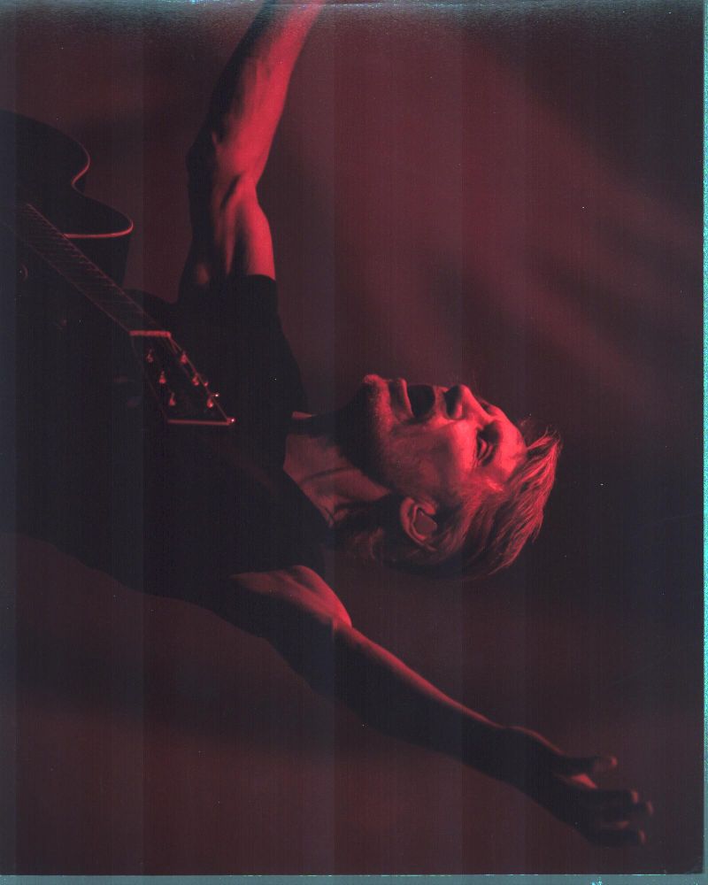 Roger Waters performing on stage photo print, arms raised.