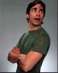Justin Long photo print featuring him in a green shirt with arms crossed.