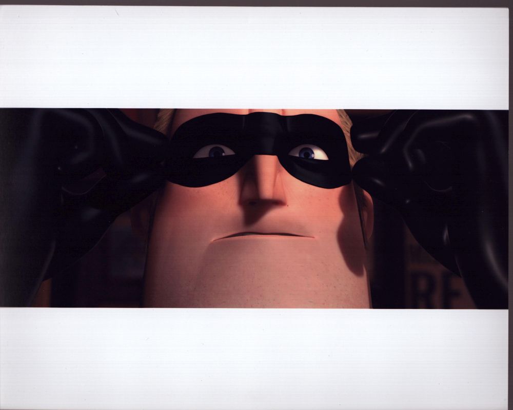Craig T. Nelson as Mr. Incredible putting on his mask - Photo Print
