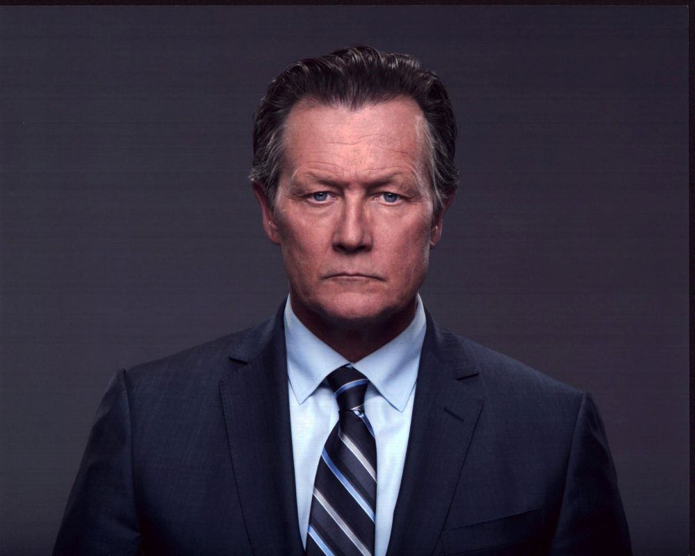 Robert Patrick photo print in gray suit with blue striped tie.