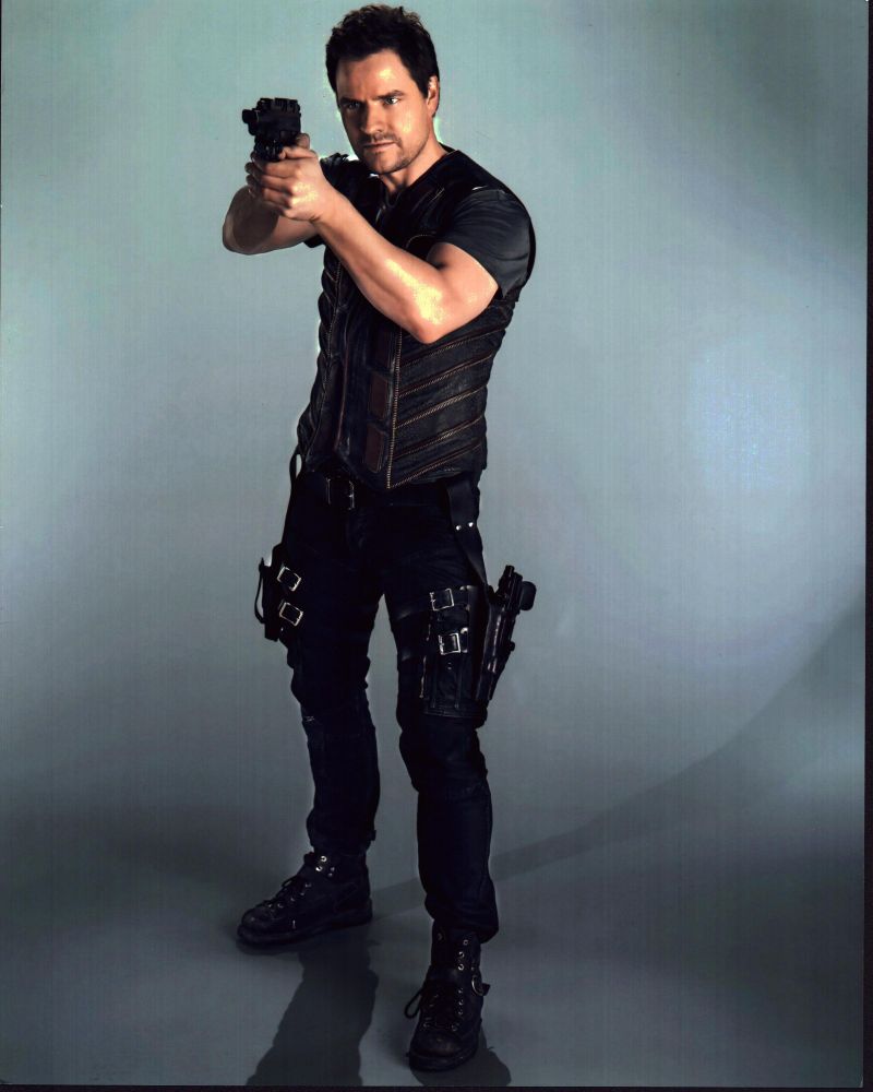Anthony Lemke Dark Matter Photo Print posed with gun