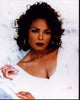 Janet Jackson in white photo print capturing her elegance and style.