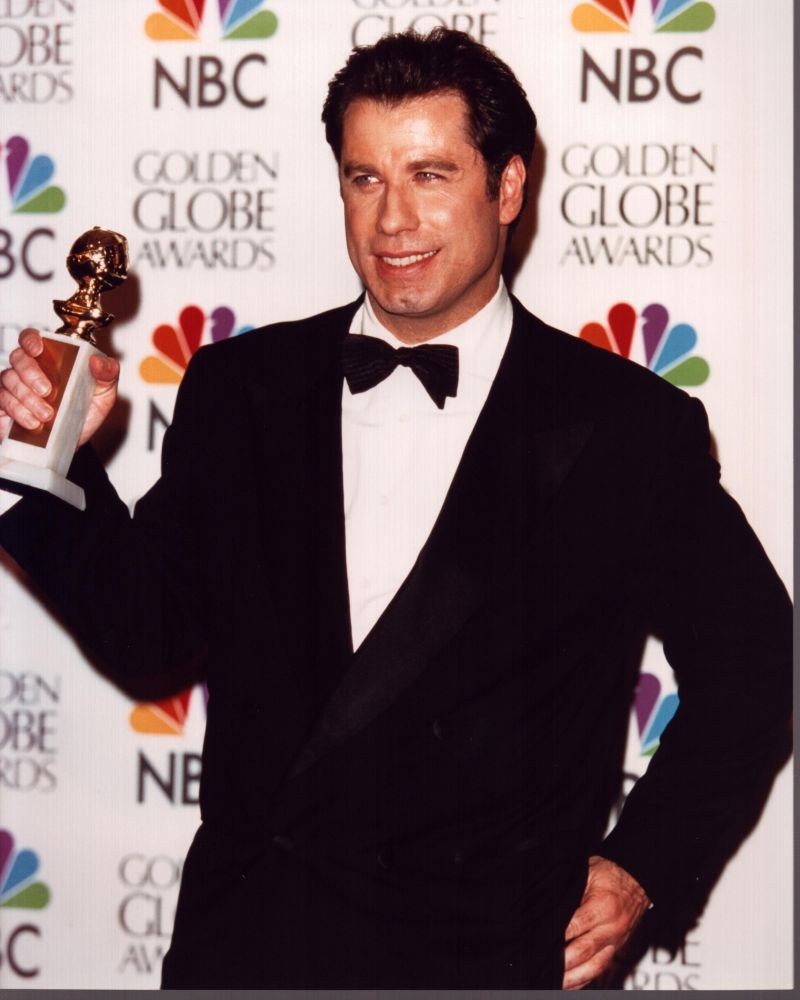 John Travolta in Tuxedo holding Golden Globe Award photo print
