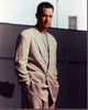 Tom Hanks in a tan suit photo print, hands in pockets, casual elegance.