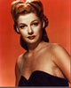 Ann Sheridan headshot in sheer black top with orange background photo print.