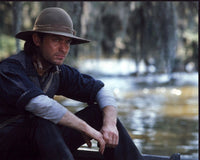 Jude Law sitting by water in Cold Mountain photo print.