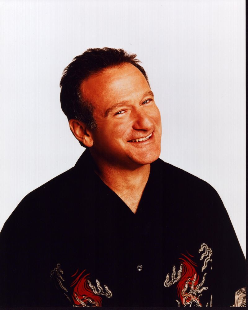 Close-up photo print of Robin Williams in black and red shirt.