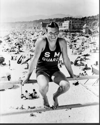 Buster Crabbe sitting on rail black and white photo print
