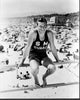 Buster Crabbe sitting on rail black and white photo print
