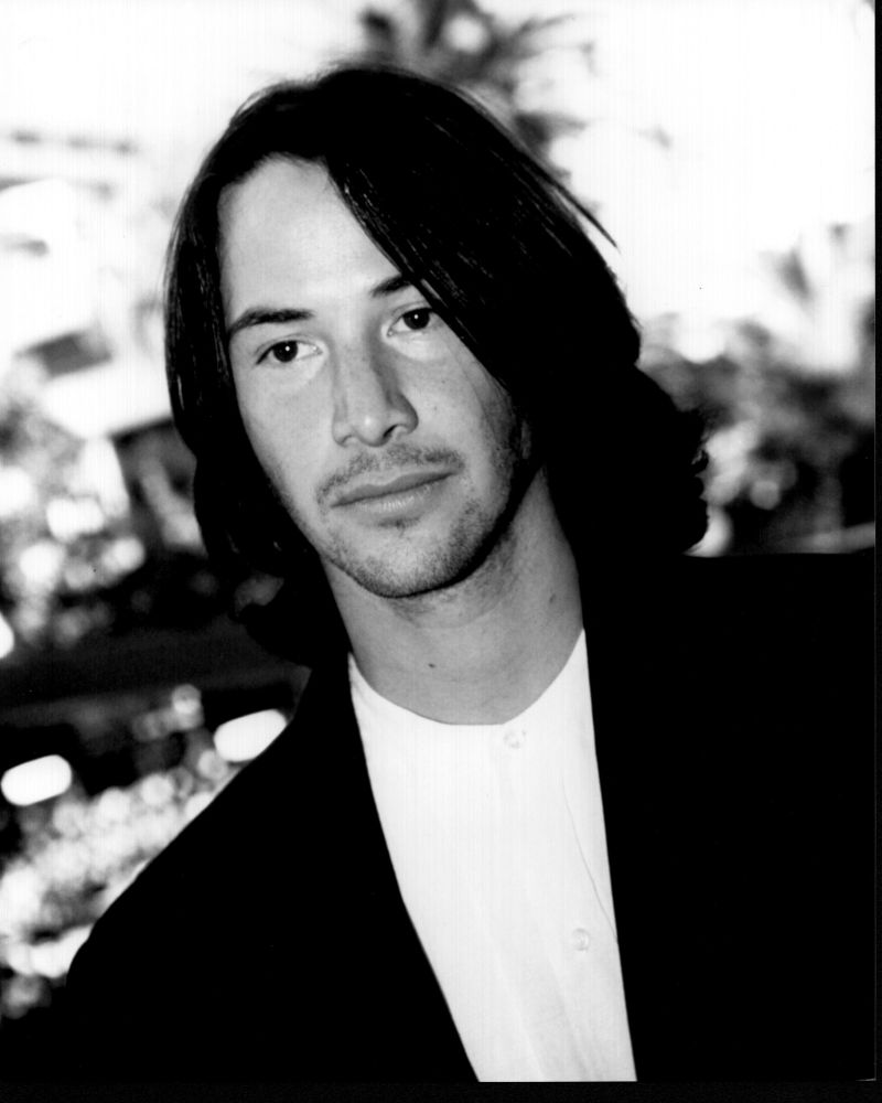 Black and white photo print of Keanu Reeves in a blazer.