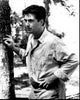 Alec Baldwin leaning on a tree in black and white photo print