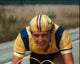 Dennis Christopher in yellow racing uniform from Breaking Away movie photo print