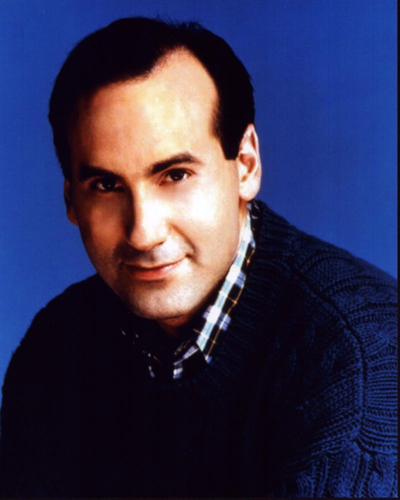 James Eckhouse headshot photo print in navy sweater