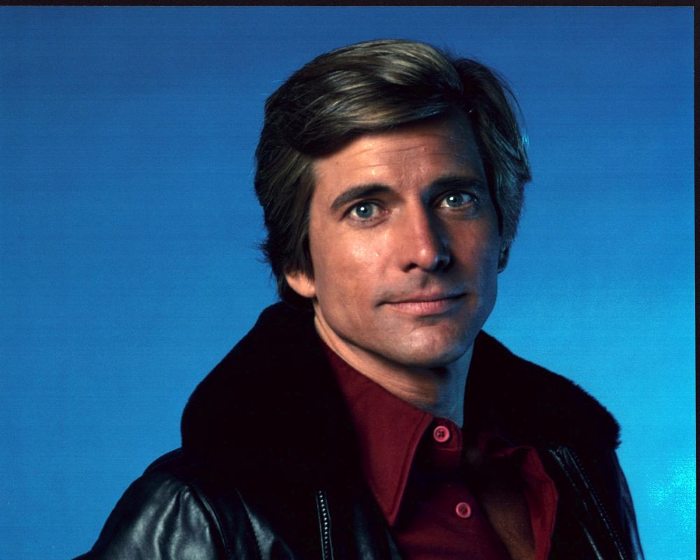 Dirk Benedict headshot photo print in black leather jacket with fur collar.