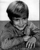 Jon Provost young headshot in checkered shirt black and white photo print