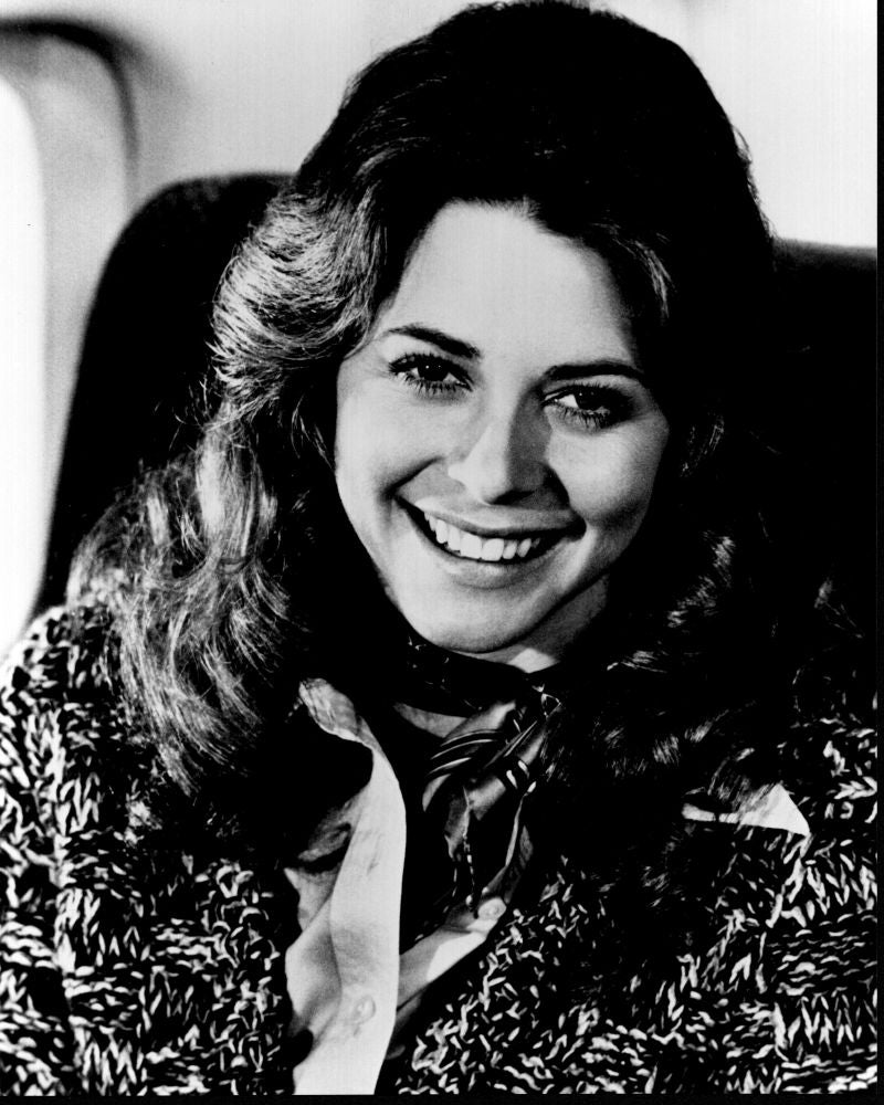 Lindsay Wagner smiling in a sweater and scarf black and white photo print.