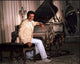 Liberace Sitting at Gold Piano Photo Print